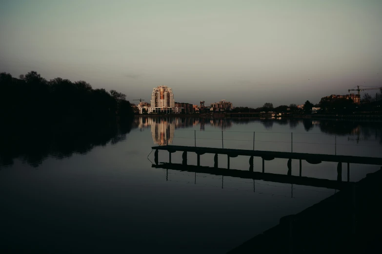 a picture taken from a dock looking across the water