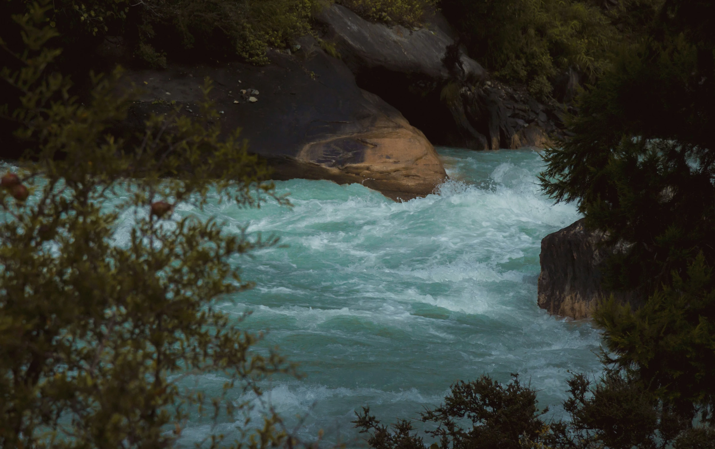 there is water coming down the side of a cliff