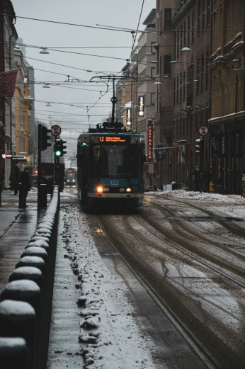 bus on street covered with snow and light poles