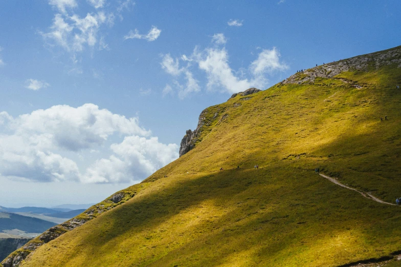 a person walking down a steep mountain side