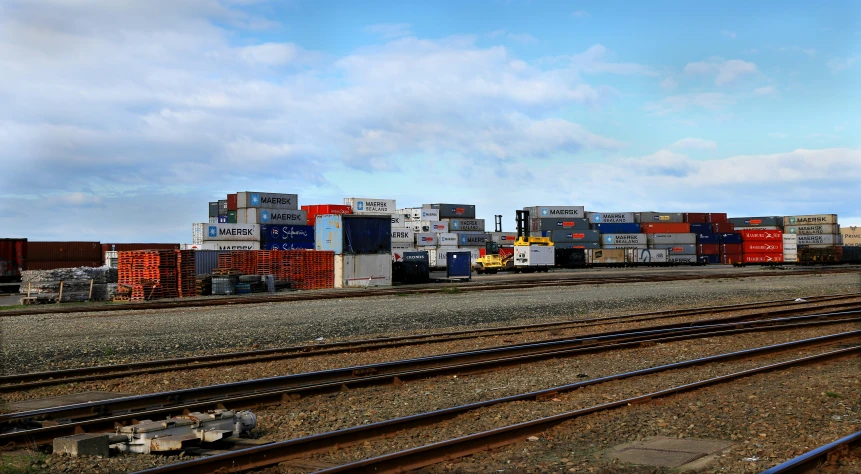 cargo containers are stacked on top of the rail