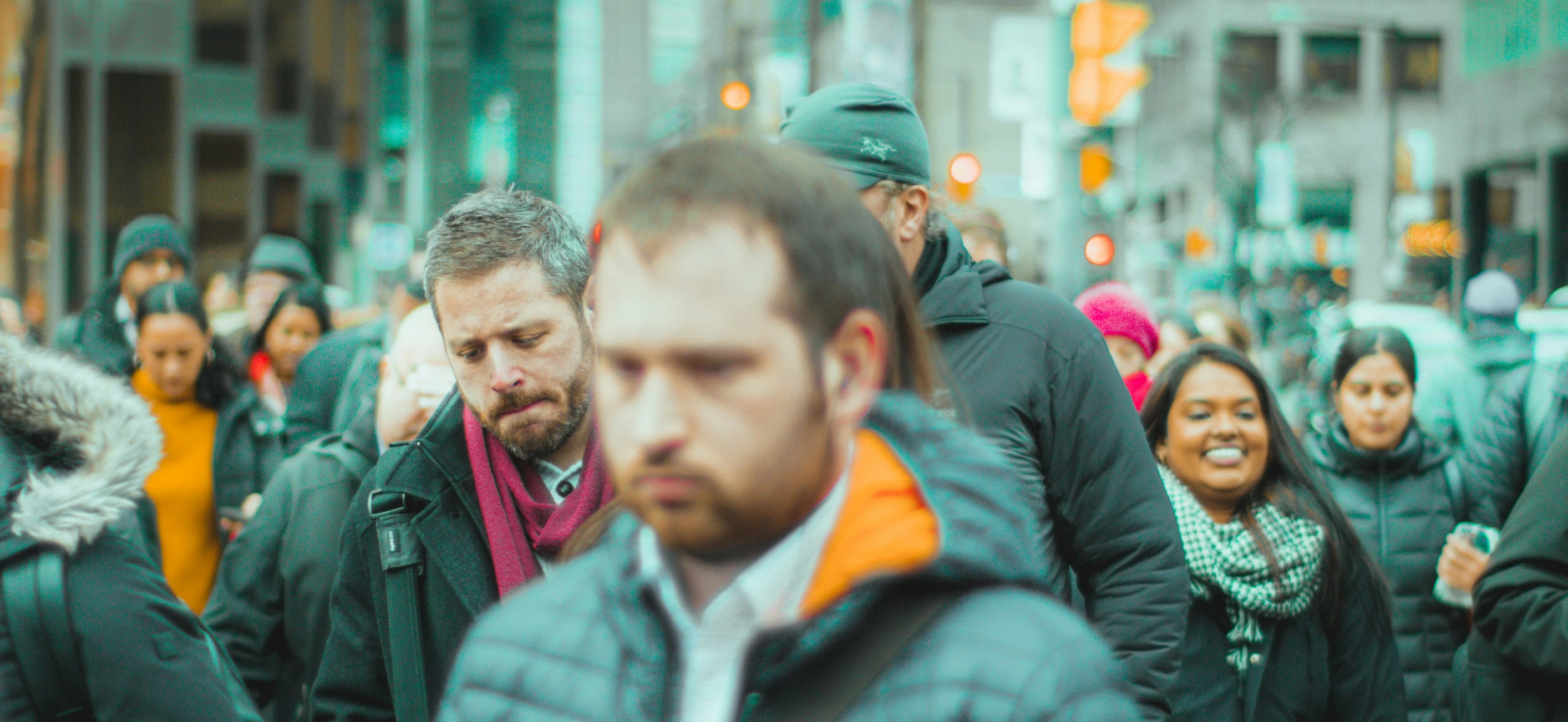 many people walking and talking while holding on to each other