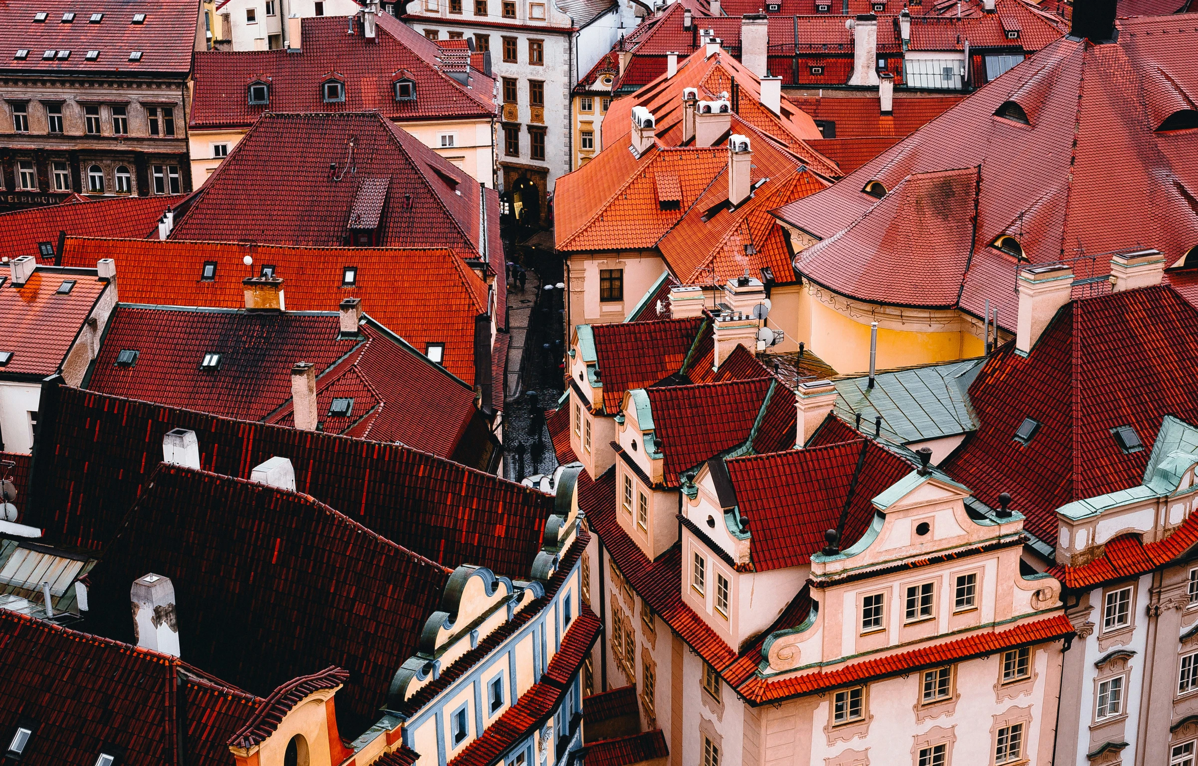 roofs that are covered in red tile on top of a building