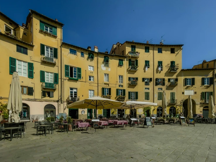 the restaurant patio has many tables and chairs