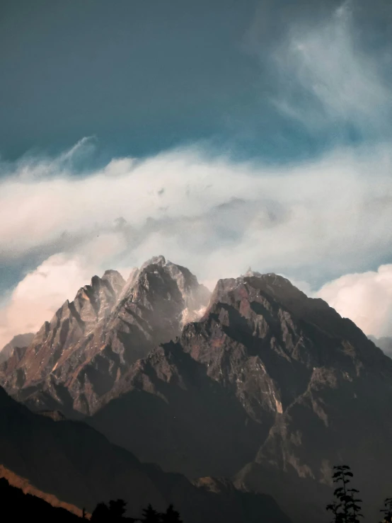 some very nice mountains with the cloudy skies in the background