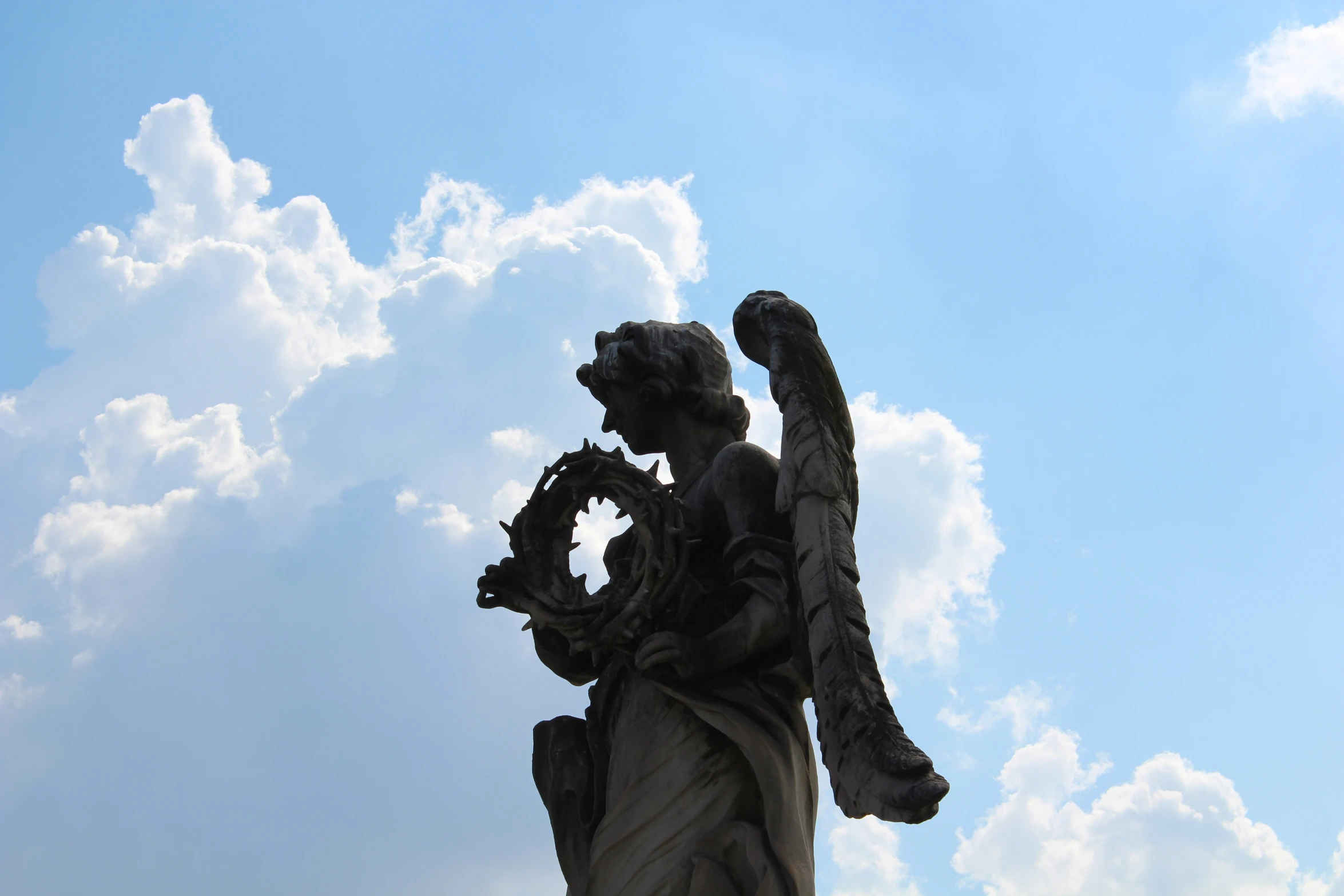 a statue with wings on top of it