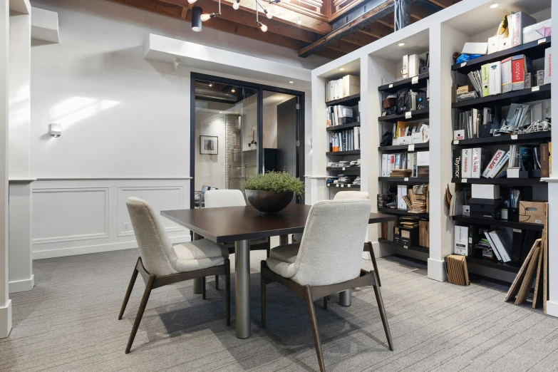 a nice modern home office with wooden ceiling