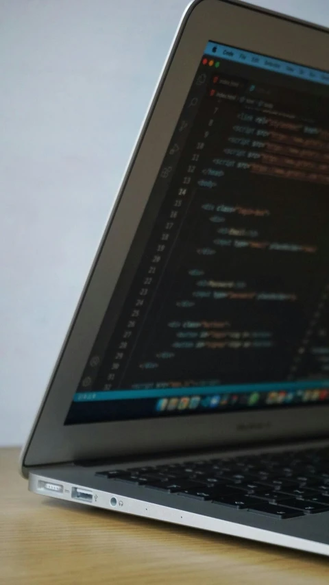 a laptop with a bunch of code on the screen