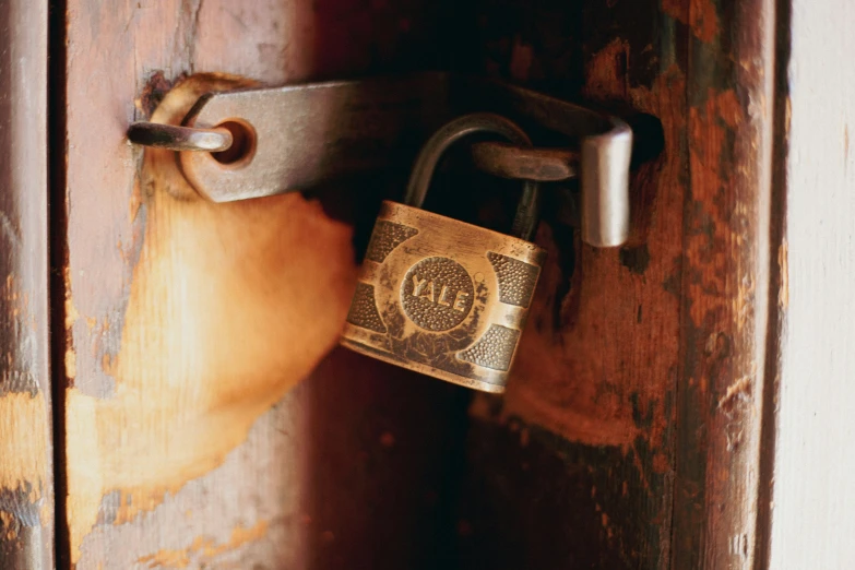 an old lock that is in a wooden door