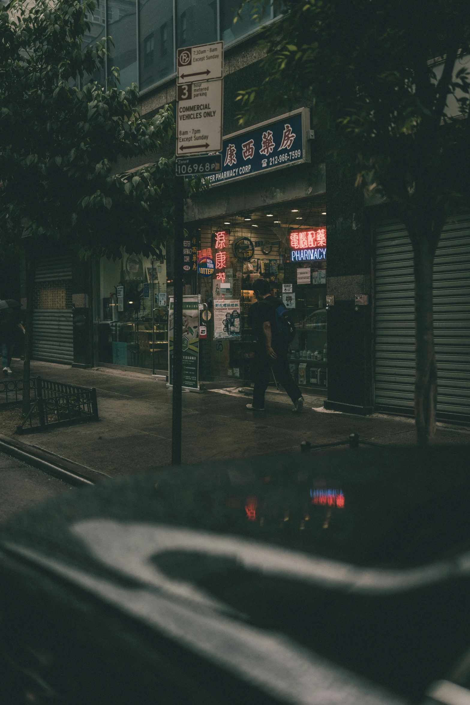 a group of people are walking by some stores