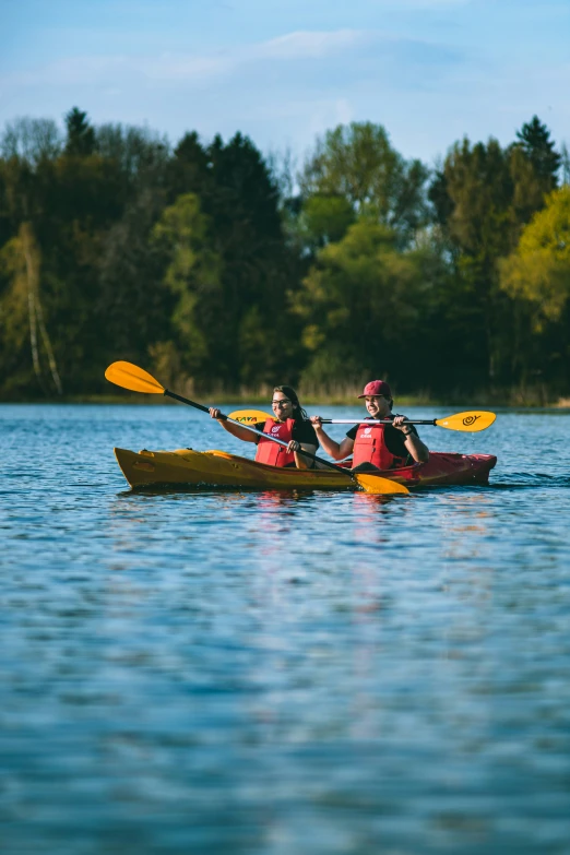 two people in a boat with a paddle