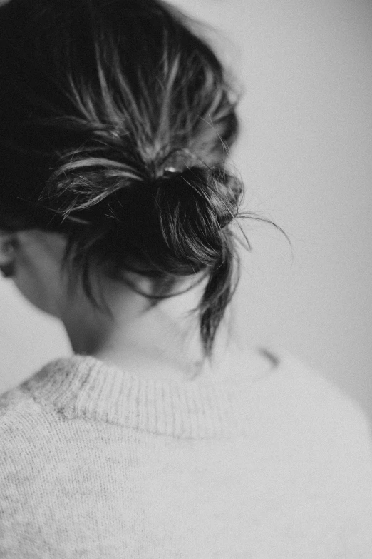 black and white pograph of a woman wearing a sweater