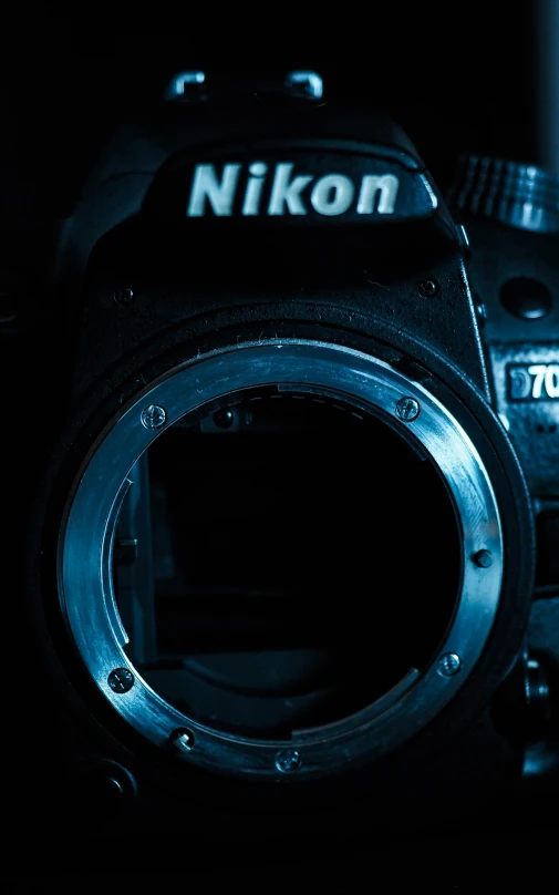 a close up of a nikon lens with the focus on the top