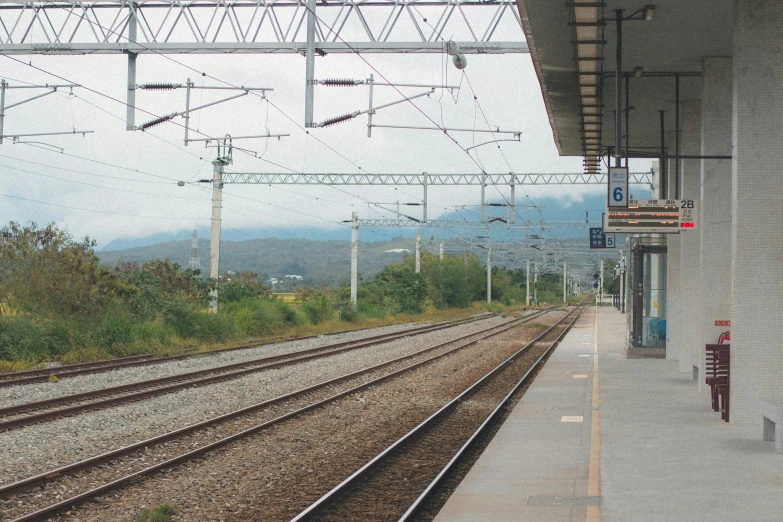 a train station with several sets of railroad tracks