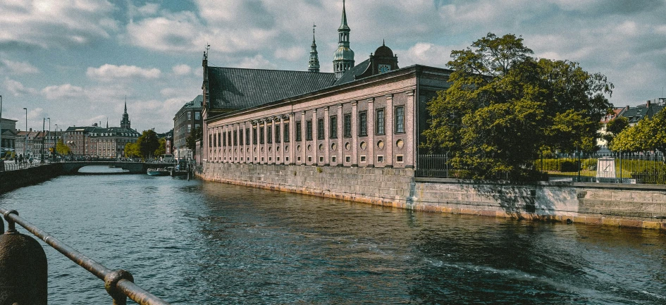 an old building in an old city next to water