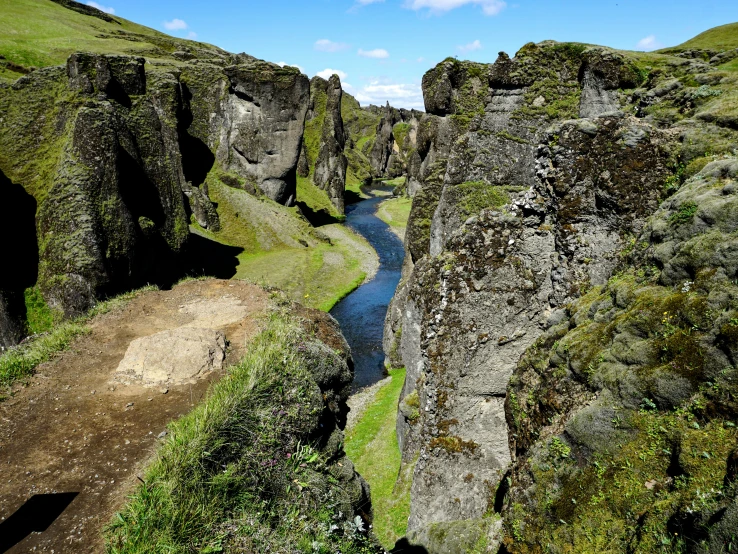 a narrow river running between two large cliffs