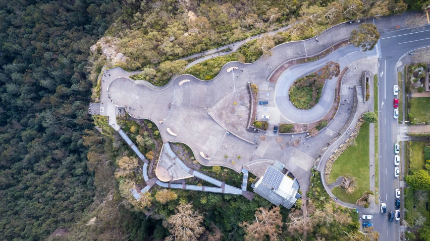 an aerial view of a park in the middle of trees and some stairs