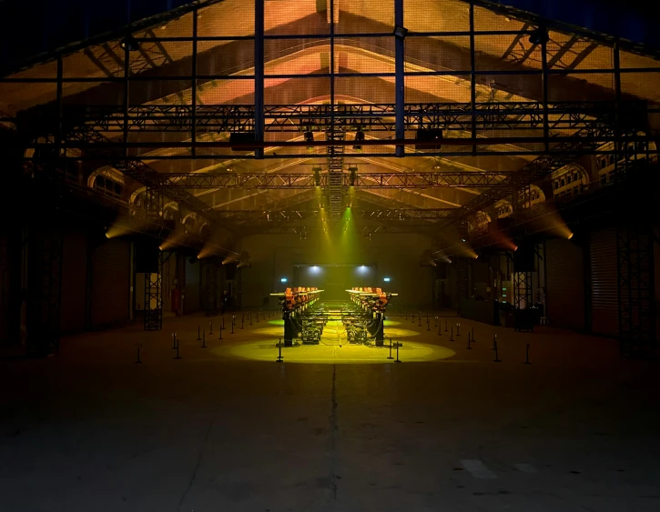 several spotlights illuminate empty stalls with lights