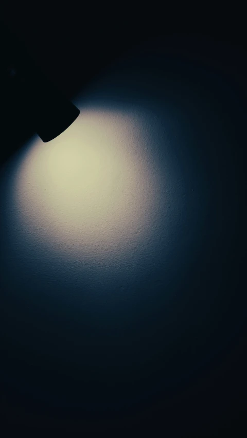 a wall lamp is shown on the table