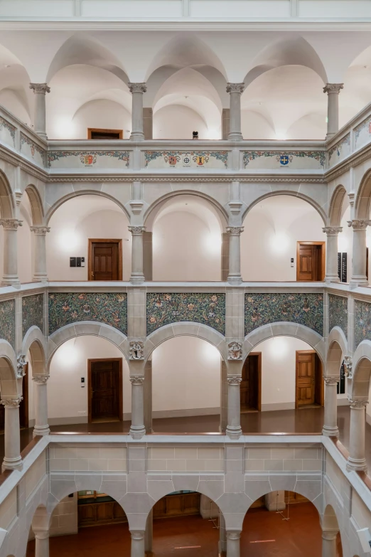 a large room with arches and a doorway