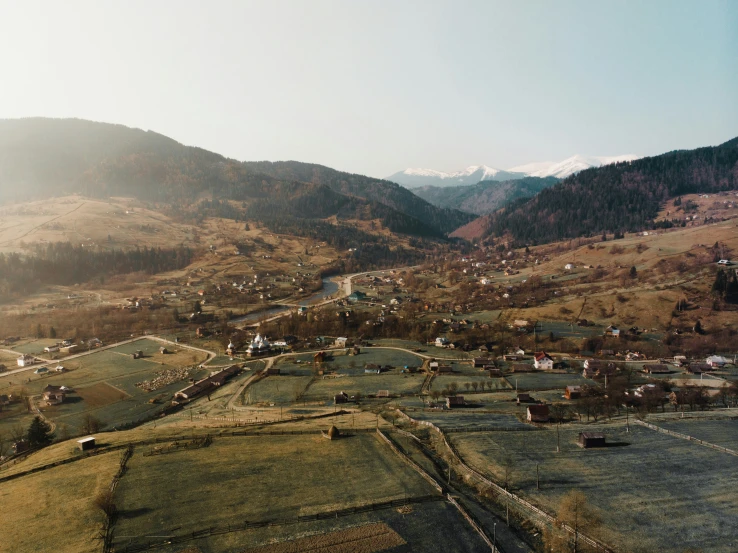 a view of some mountains and houses from above