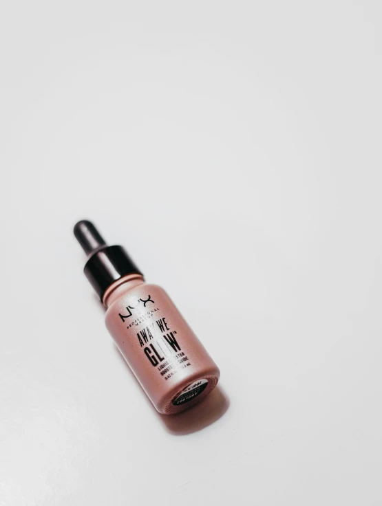 a bottle of foundation foundation on a white surface