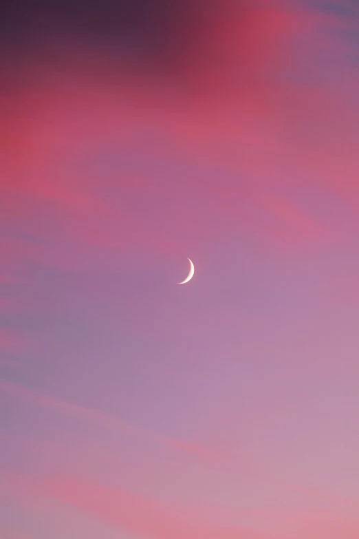 purple, pink and purple clouds with a white crescent moon