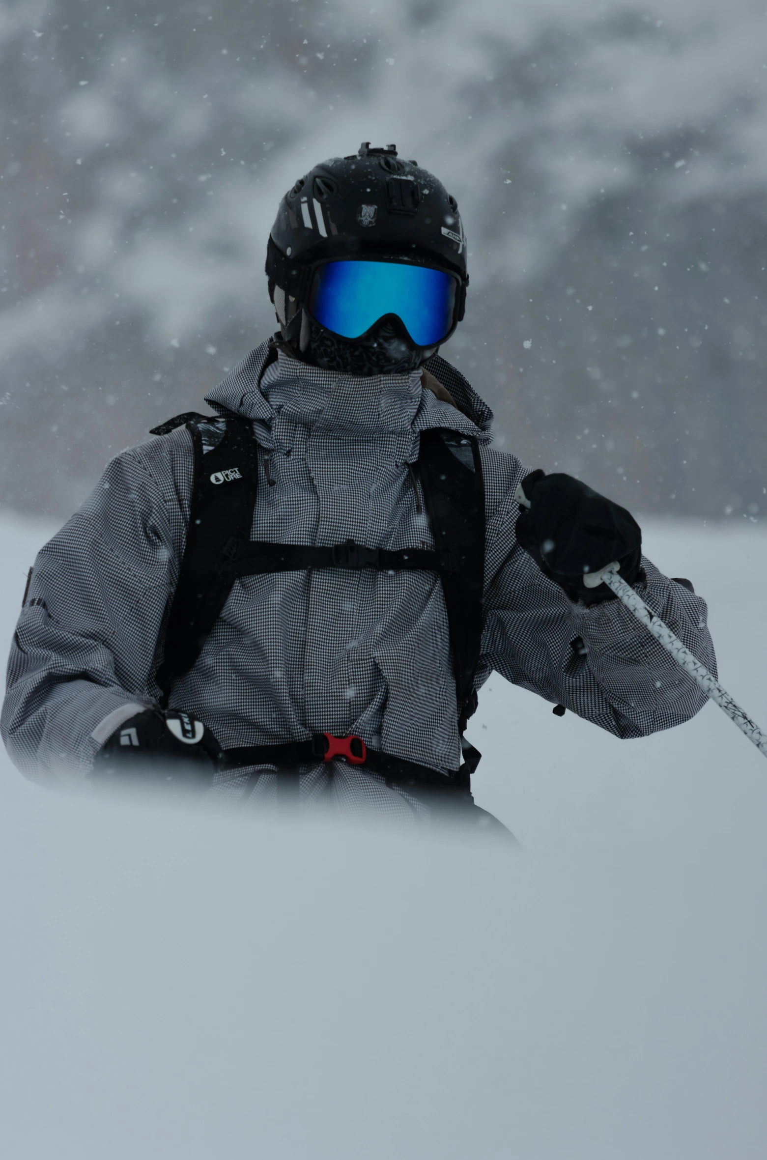 a person holding snow ski poles in the snow