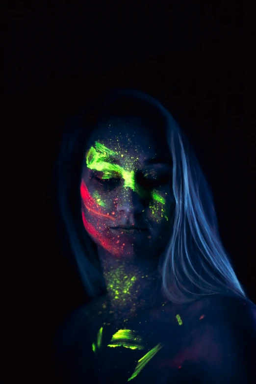 a young woman with makeup and neon colors on her face
