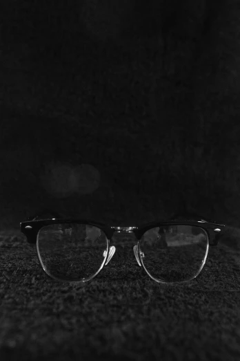 a pair of glasses is lit on a table