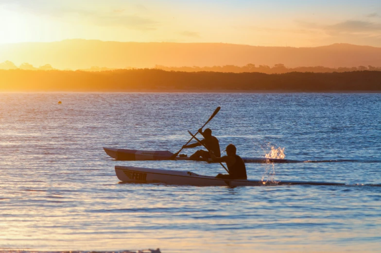 people in a boat out on the lake