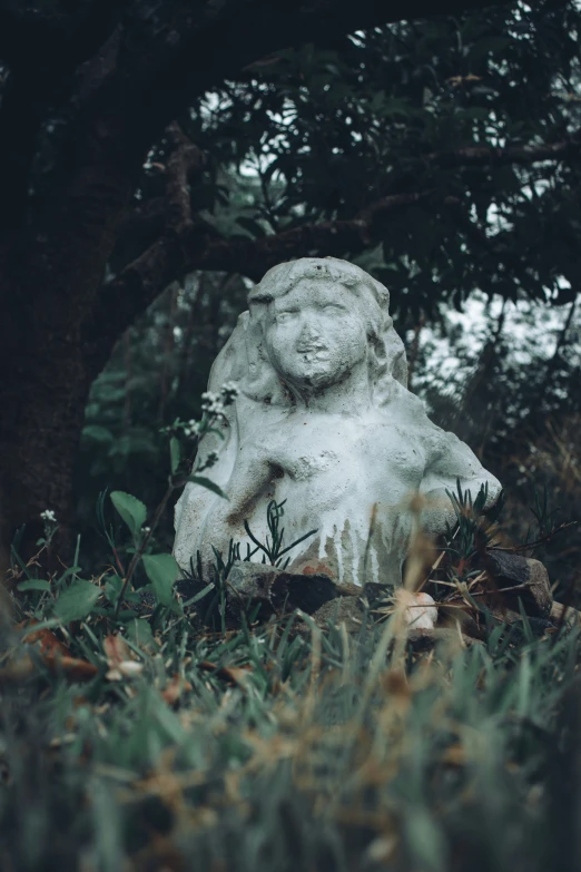 an image of a stone bust of a child