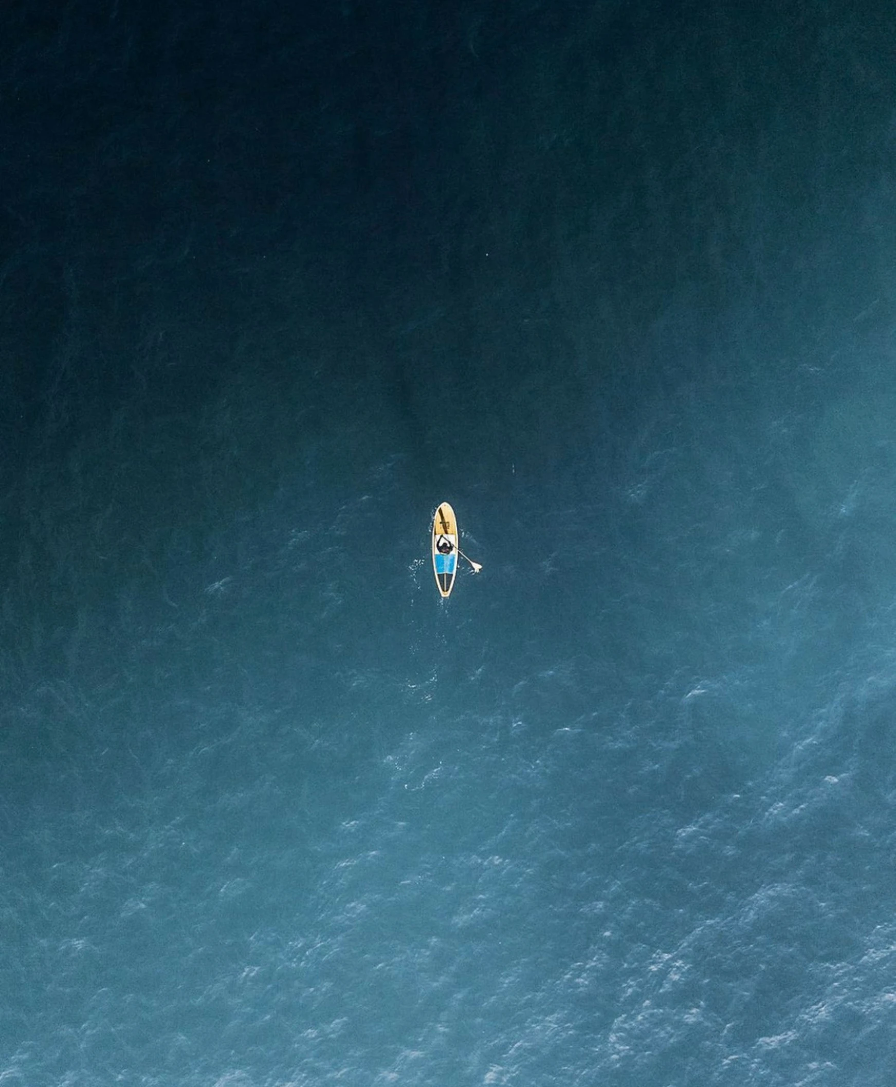 a man on a surfboard is in the ocean