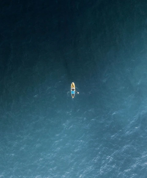 a man on a surfboard is in the ocean