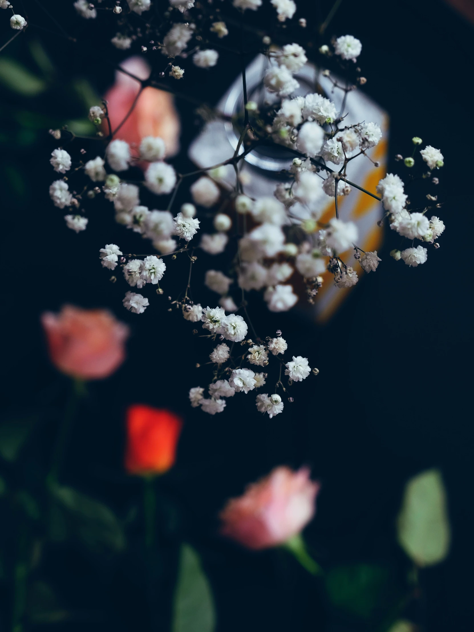 a vase full of flowers sitting on top of a table