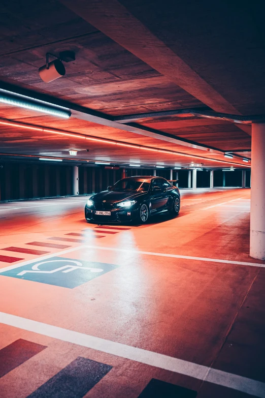 an empty parking garage with car parked inside