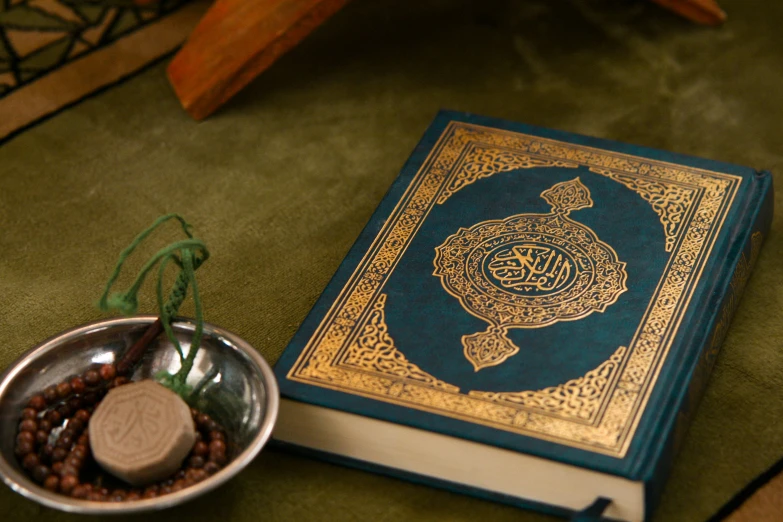 a book sitting on top of a table next to a bowl of beans