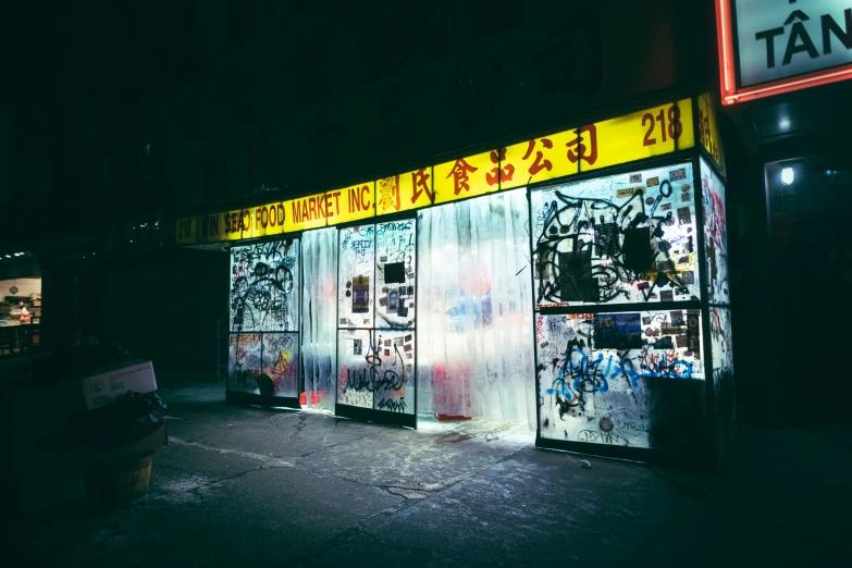 several signs are displayed on doors outside a building