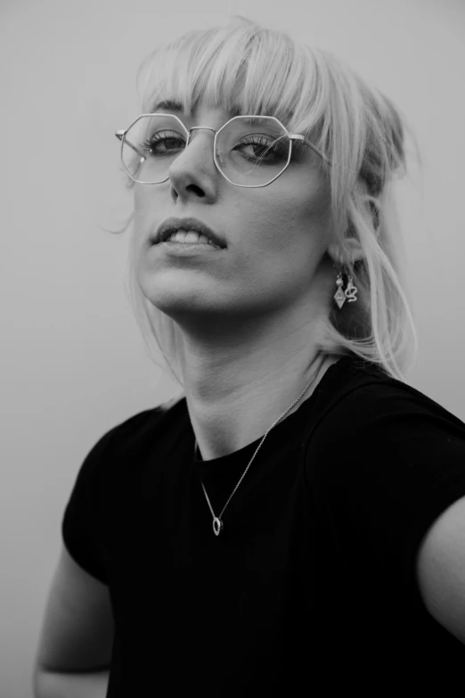 black and white po of a woman with large glasses