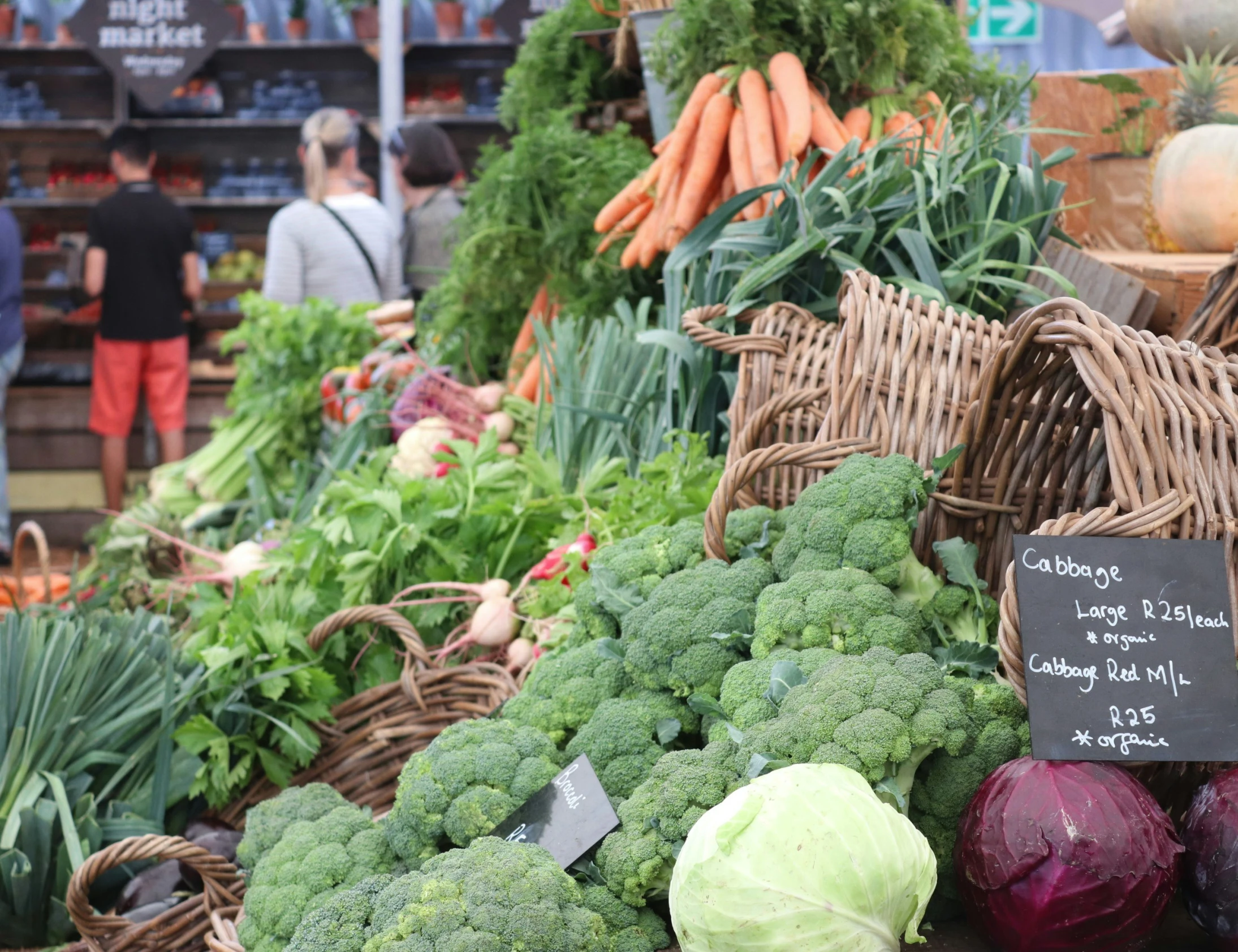 a vegetable stand is filled with fresh produce