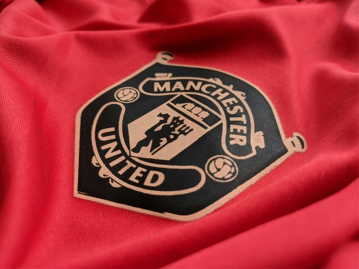 a manchester united soccer jacket worn in red