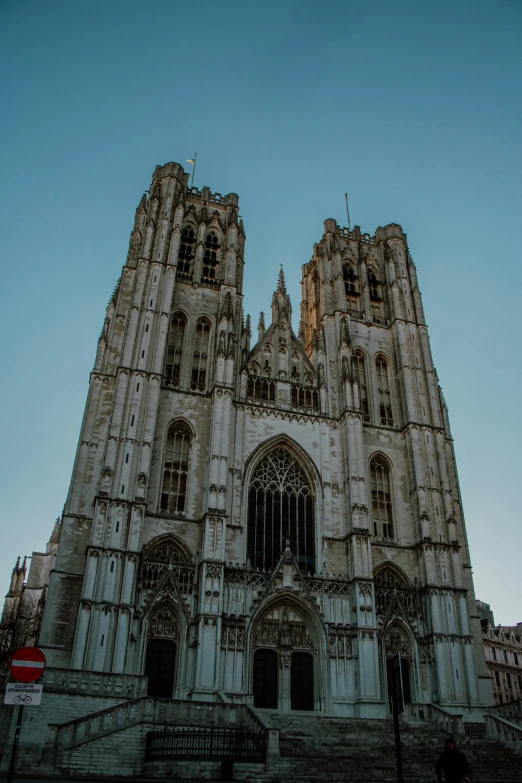 an old cathedral and stairs is pictured against the clear sky