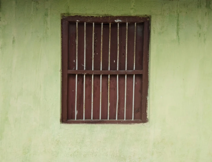 a bench is sitting in front of an unfinished window