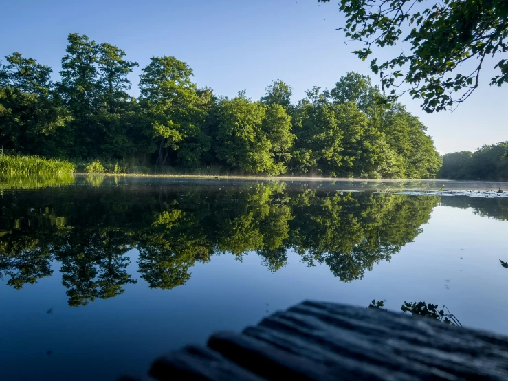 a boat dock sitting in front of a lake