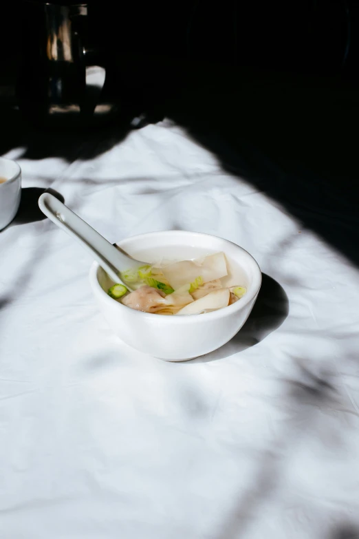 a bowl filled with food on top of a table