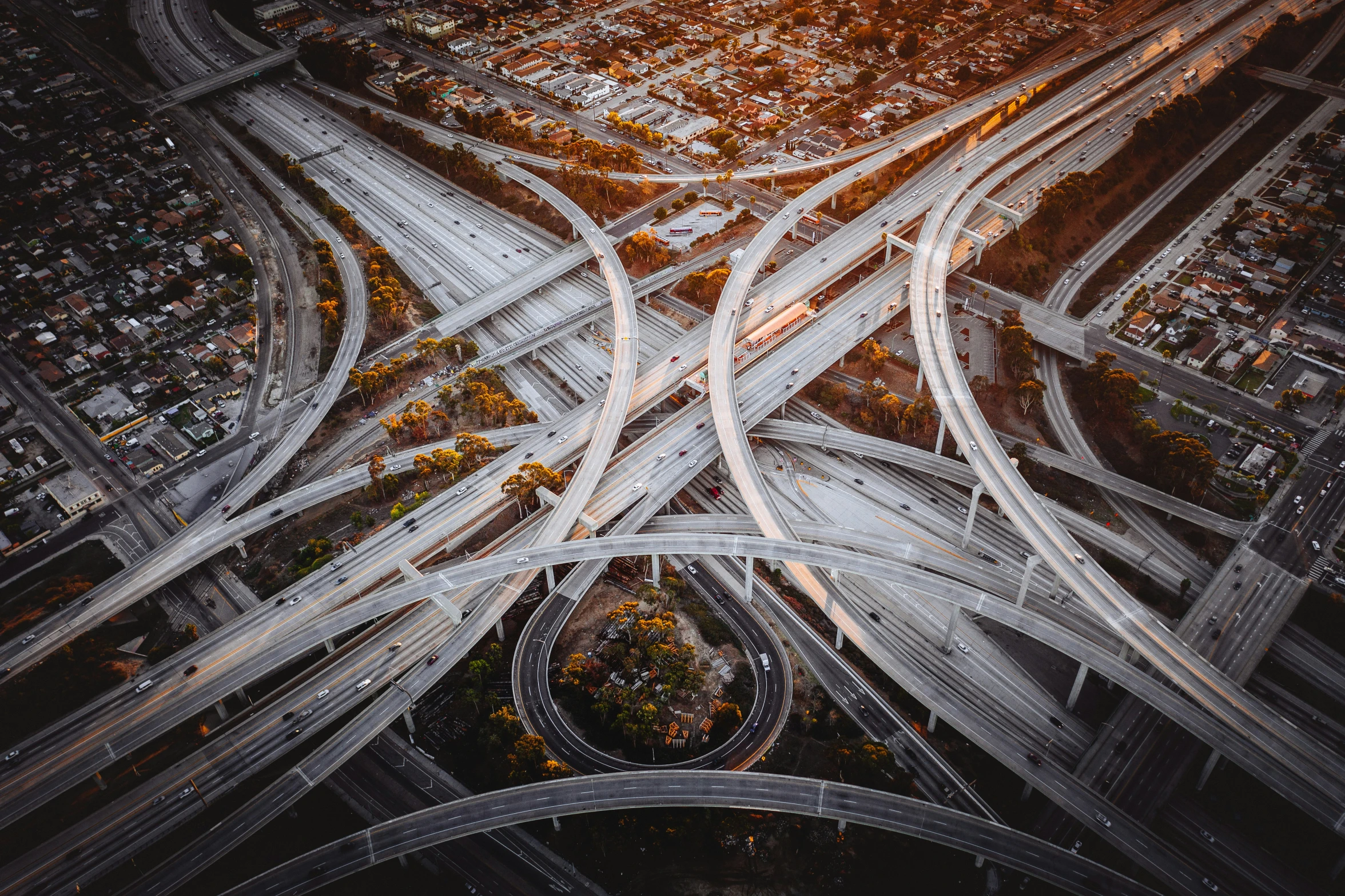 an aerial view of a highway intersection and other traffic