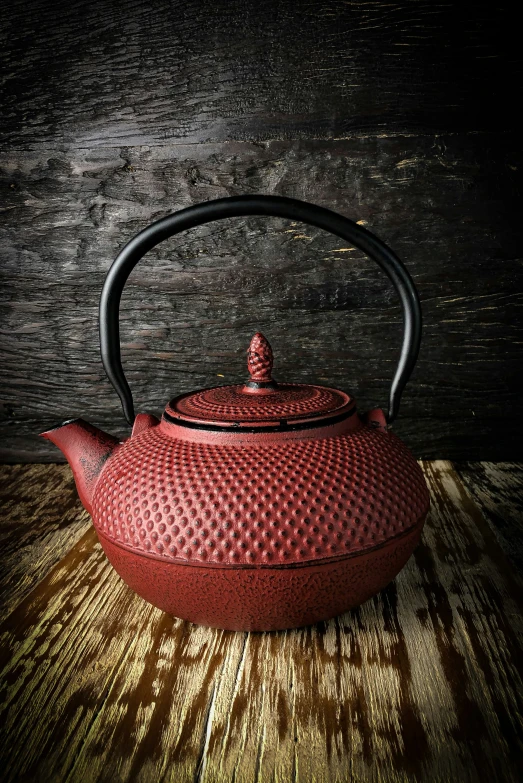 a red kettle that is sitting on the table