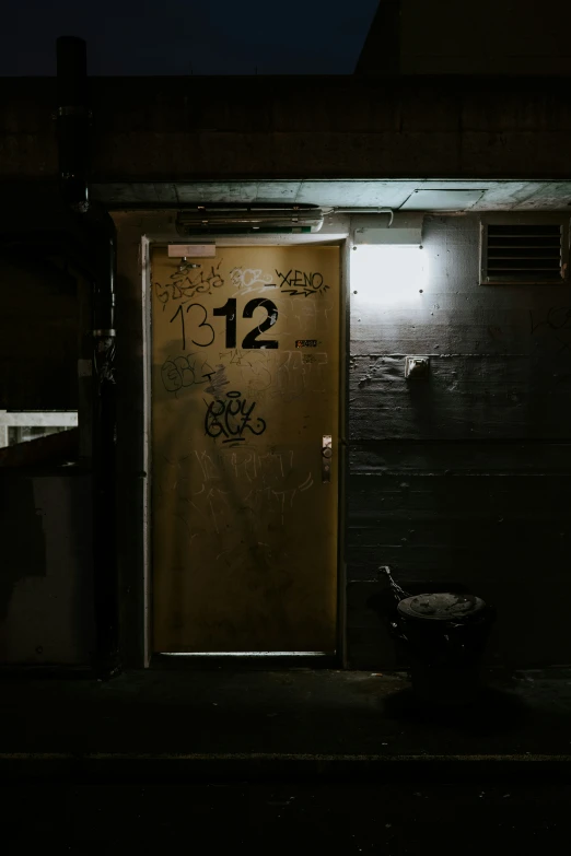 a door with a small bowl of fruit at the entrance of a building