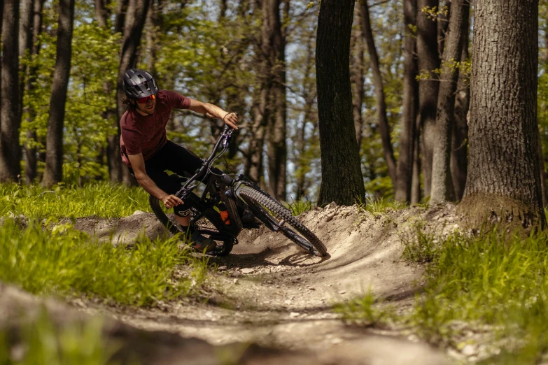 a person riding a bike on top of a dirt field