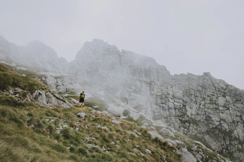 a person that is walking up a hill